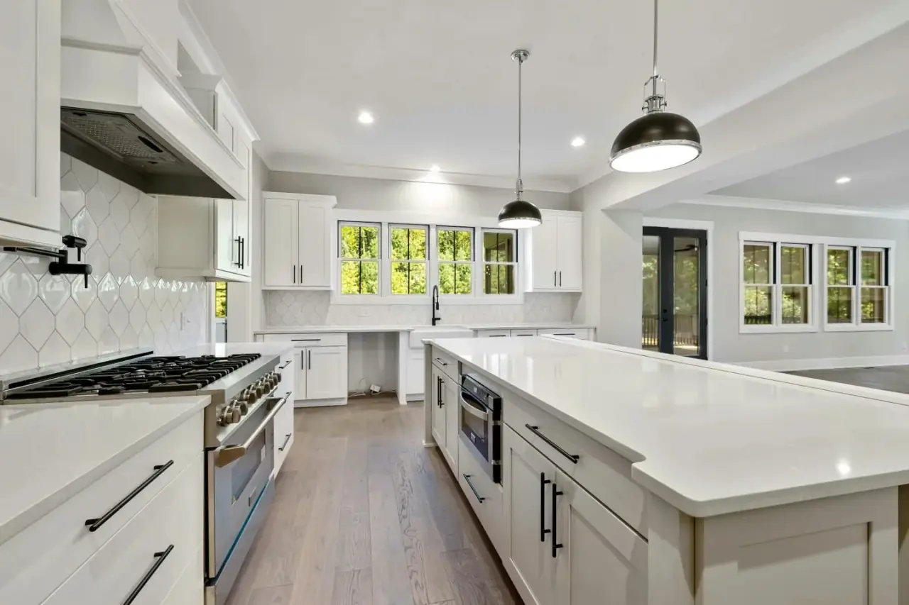 White shaker kitchen with black hardware and island